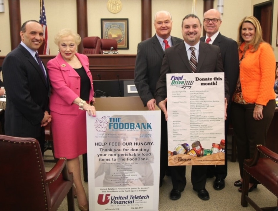 Freeholder John P. Curley announces the fourth annual spring food drive to benefit the FoodBank of Monmouth and Ocean Counties at the regular Freeholder meeting on March 26 in Freehold, NJ. Pictured left to right: Freeholder Thomas A. Arnone, Freeholder Lillian G. Burry, Freeholder John P. Curley, Carlos M. Rodriguez, executive director of the FoodBank, Freeholder Director Gary J. Rich, Sr. and Freeholder Deputy Director Serena DiMaso.